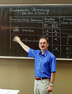 xpert teaching in front of board